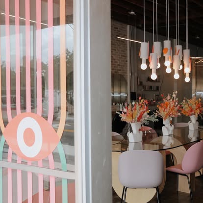 Salon interior through the eye-motif window decal